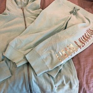 Victoria’s Secret zip up hoodie and crop pant.